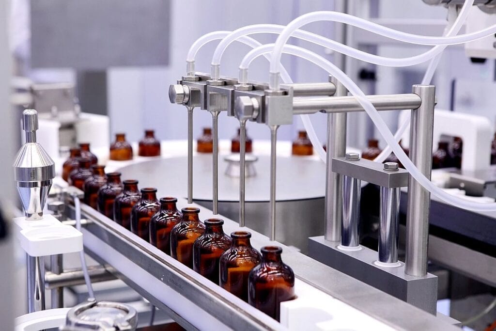 Brown bottles in manufacturing plant; payer systems concept