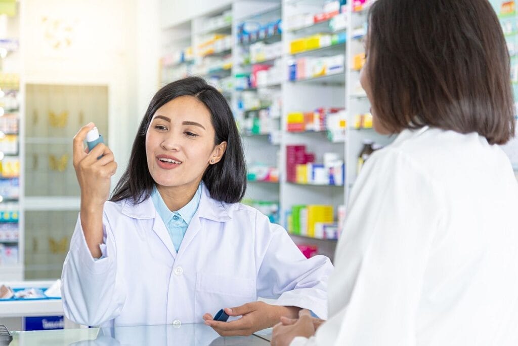 Pharmacist discuss medication; specialty drug access concept
