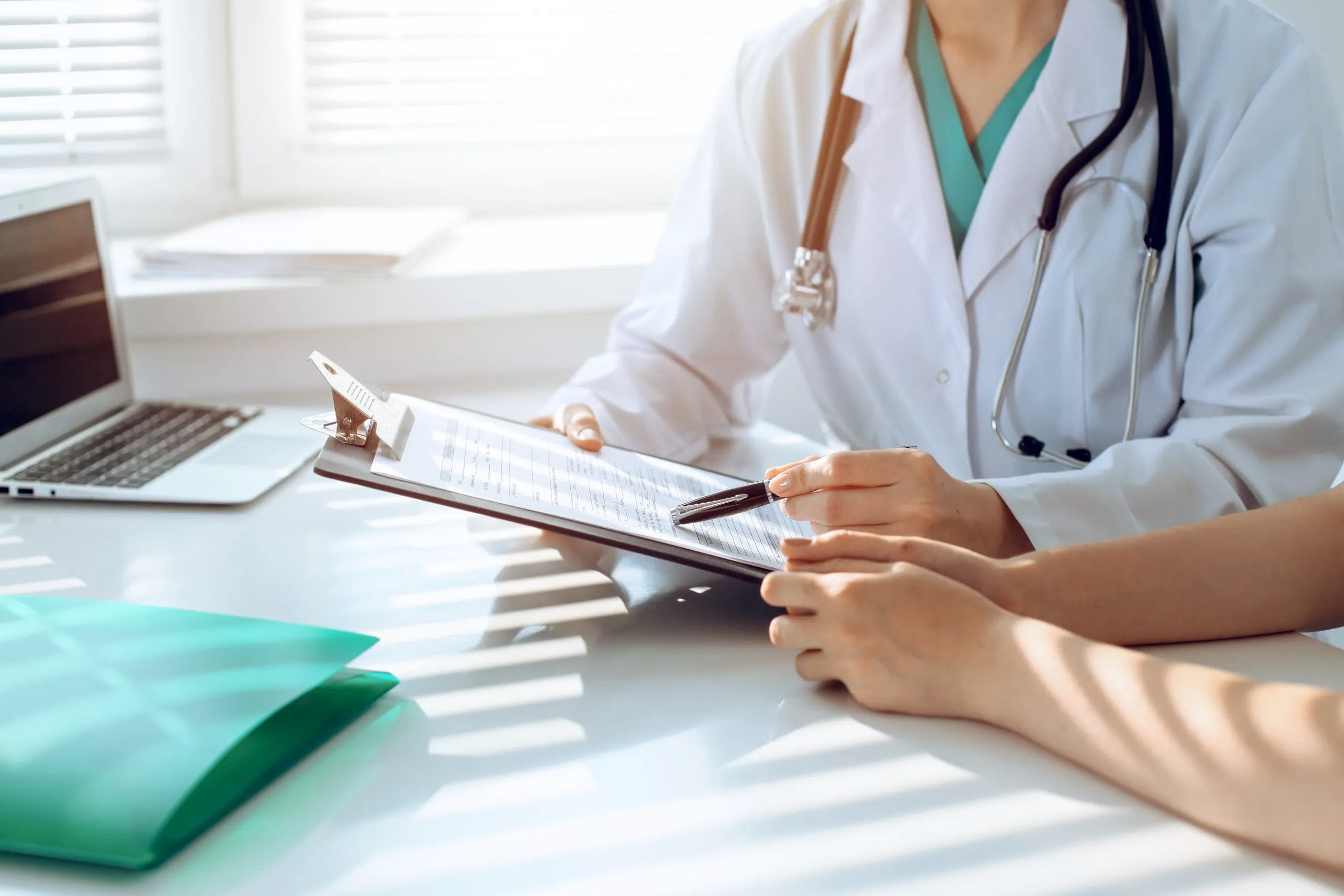 Doctor and patient discussing something in clinic