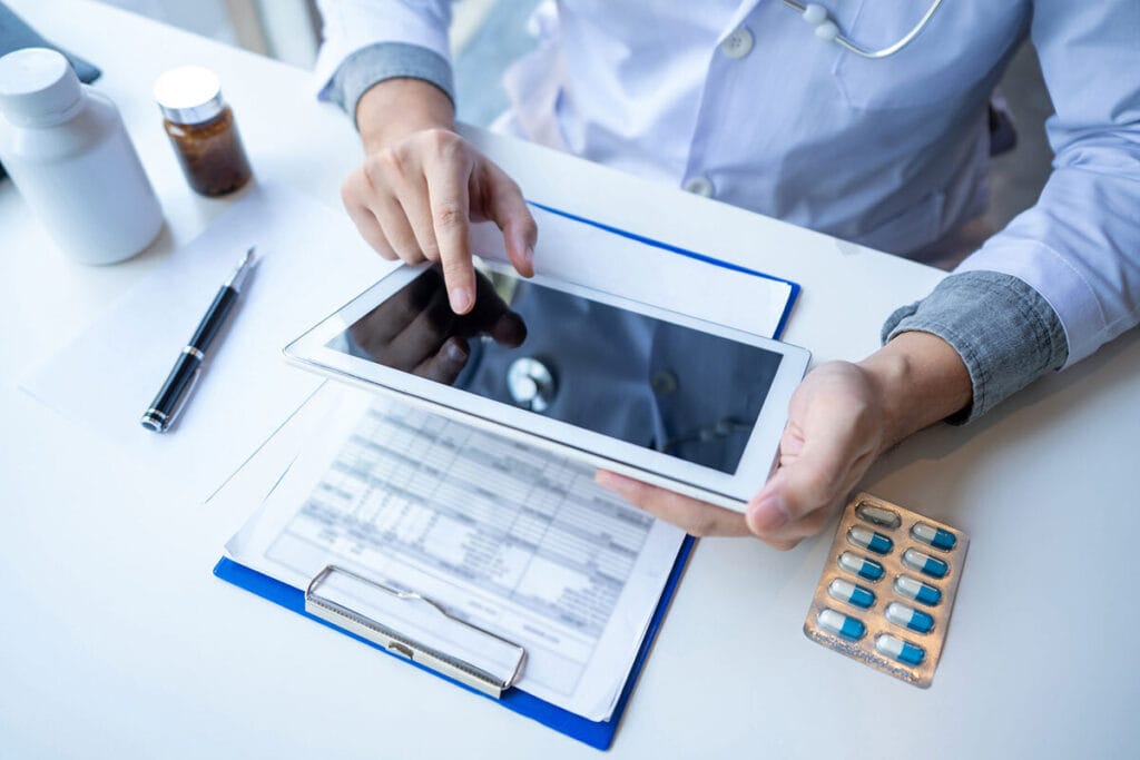 Pharmacist or doctor on a tablet